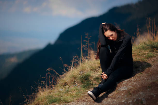 istock Woman Stretching her Legs Preparing for Mountain Hike 1146167511