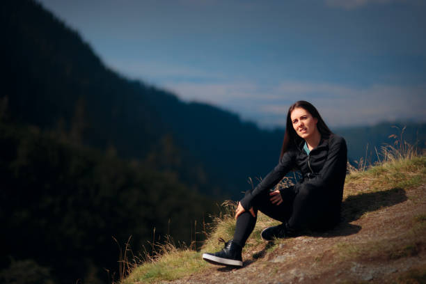 istock Woman Stretching her Legs Preparing for Mountain Hike 1146167525
