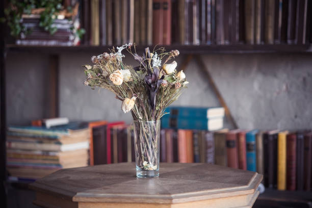 istock Dried flowers in a vase on the library table. 1146169200
