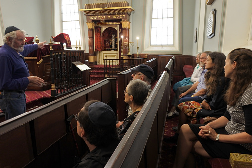 Hobart, Tasmania - March 21, 2019: Visitors at Hobart Synagogue. The synagogue is the oldest synagogue building in Australia and is a rare example of the Egyptian Revival style of synagogue architecture
