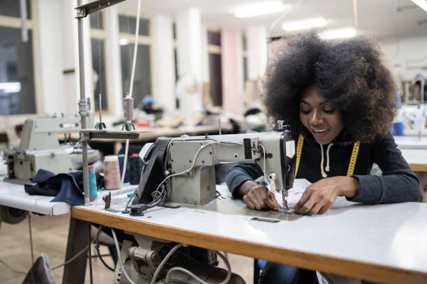 istock African worker in fashion factory using sewing machine 1146176264