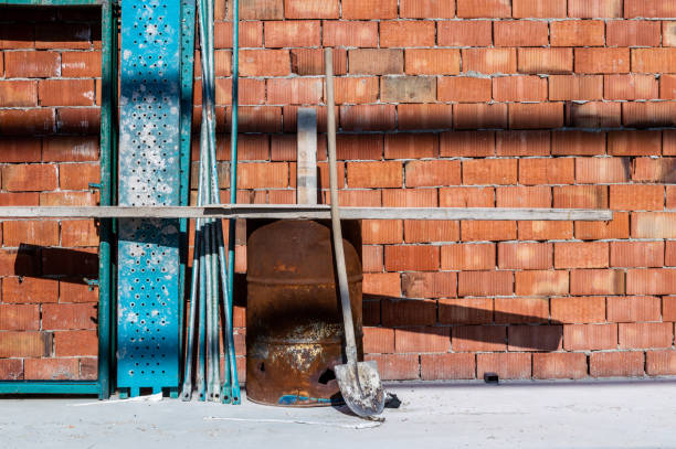 istock Old and used construction materials in front of a brick wall 1146178566