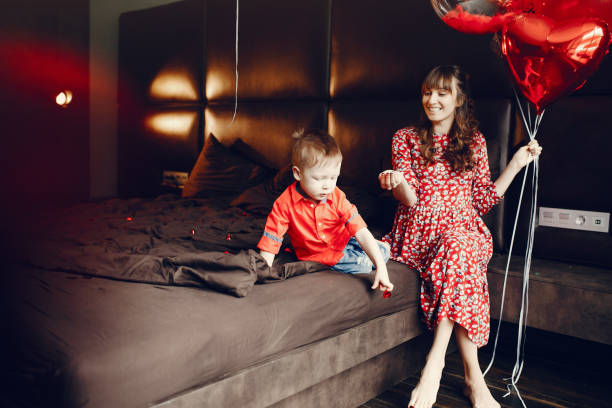 istock Elegant mother with little son in a bed 1146180979