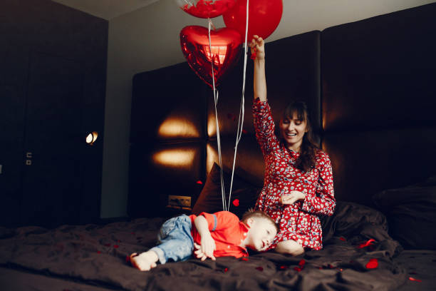 istock Elegant mother with little son in a bed 1146184989