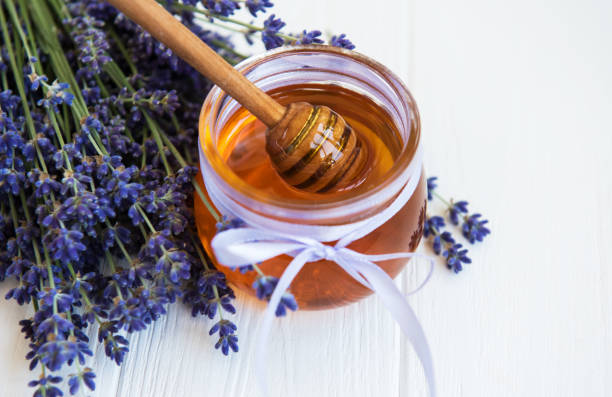 istock Jar with honey and fresh lavender flowers 1146185120