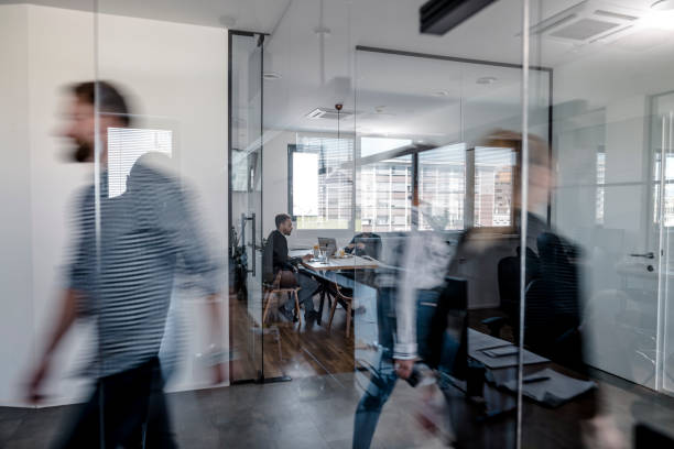 istock Business colleagues walking in the office 1146187180