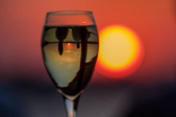 istock Glass of wine and setting sun 1146188080