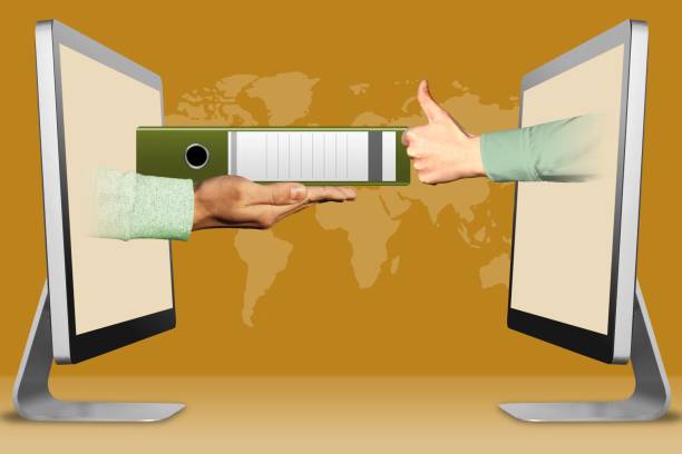 istock commerce concept, two hands from laptops. folder and thumbs up, like. 3d illustration 1146188822