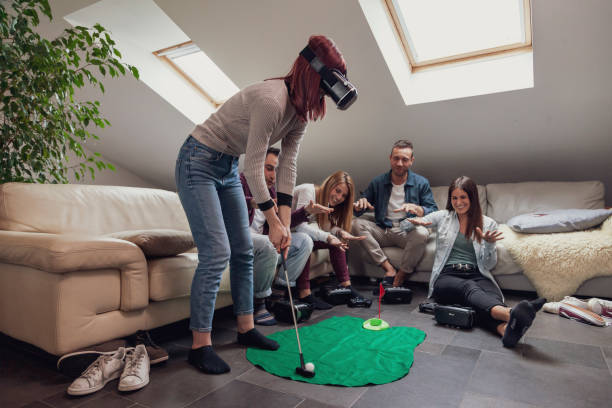 group of young adults have fun playing golf - golf four people young adult playing imagens e fotografias de stock