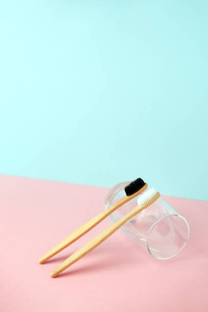 istock Zero-waste, biodegradable bamboo toothbrush and glass modern 3d background, minimal eco-friendly concept 1146193913