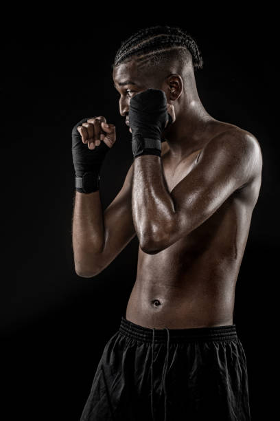 istock Black fight sport athlete shadow boxing 1146195414