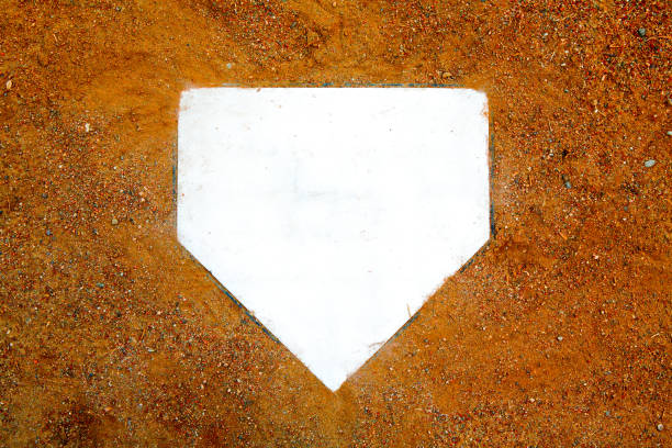 Baseball/Softball Home Plate Background home plate background on clay dirt home plate stock pictures, royalty-free photos & images