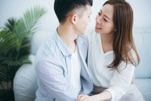 istock Loving couple embracing and relaxing at home 1146196592