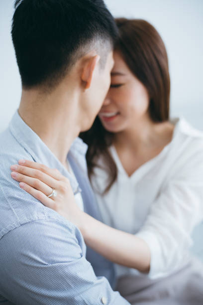 istock Newly engaged couple embracing and kissing 1146196606