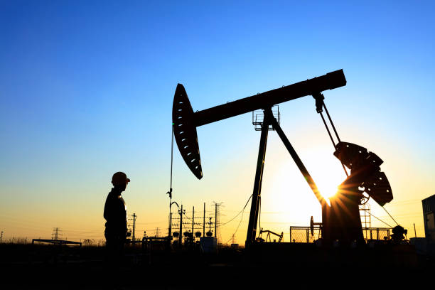 istock oil field, the oil workers are working 1146200189