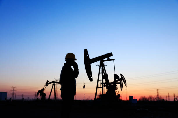 istock oil field, the oil workers are working 1146200711