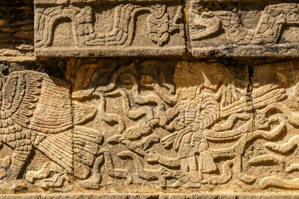 istock Mayan figures carved on stone wall at Chichen Itza, Yucatan Peninsula, Mexico 1146202946