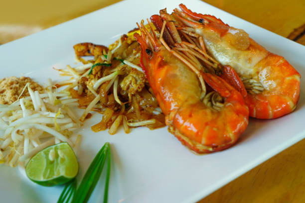 istock Pad Thai, large shrimp in a white dish 1146207389