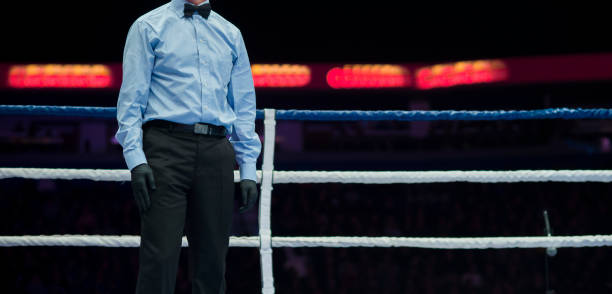 Midsection Of Referee Standing In Boxing Ring  boxing referee stock pictures, royalty-free photos & images