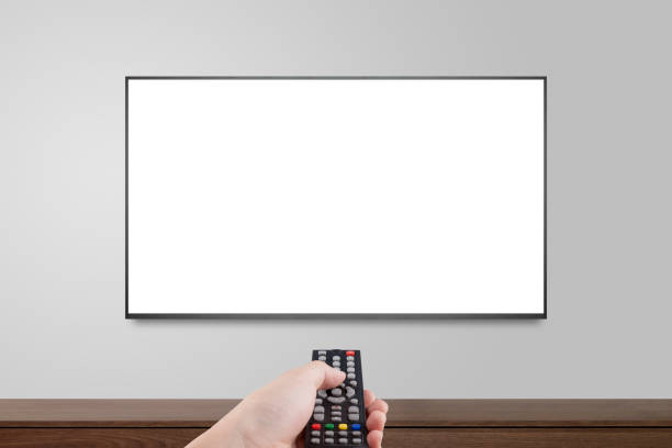 istock Television on white wall with hand using remote control, TV 4K flat screen lcd or oled, plasma realistic illustration, White blank HD monitor mockup. 1146211826
