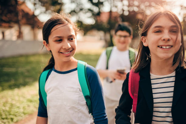 istock Girls going to school 1146212645