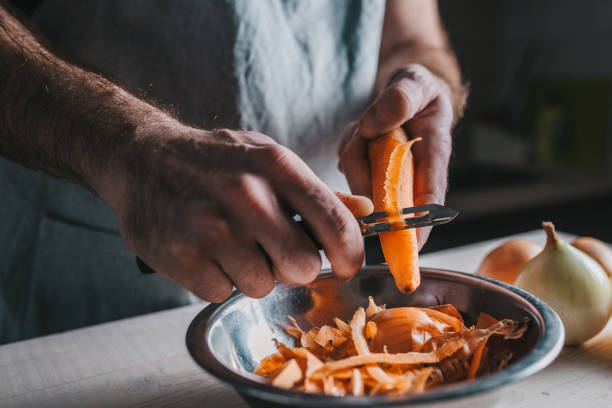 istock A qualified chef cleans ripe orange carrots in the kitchen with a special knife 1146212834