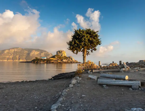View on little island Kastri near Kos in Kamari bay, Greece. Sunrise