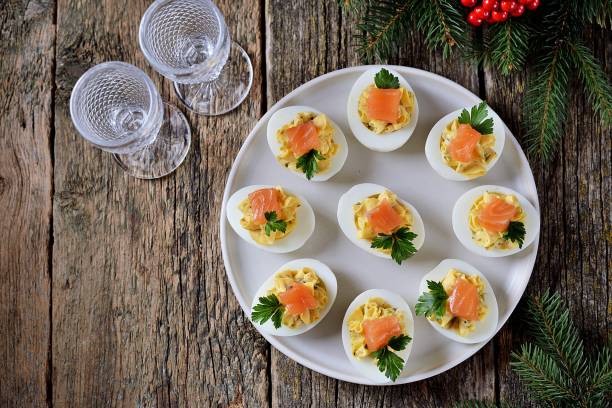 Stuffed chicken eggs with soft cheese, capers and salted salmon.