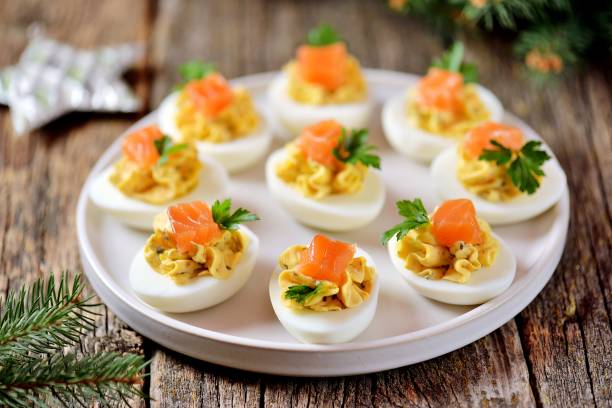 istock Stuffed chicken eggs with soft cheese, capers and salted salmon. 1146217446