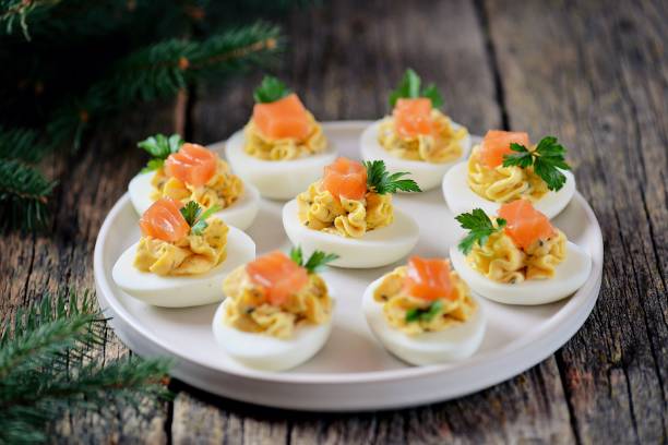 istock Stuffed chicken eggs with soft cheese, capers and salted salmon. 1146217454