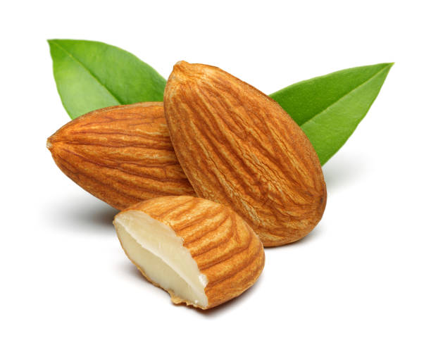 istock Group of almonds with leaves isolated on white 1146217968