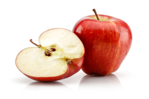 istock Whole and half red apples isolated on white 1146219241