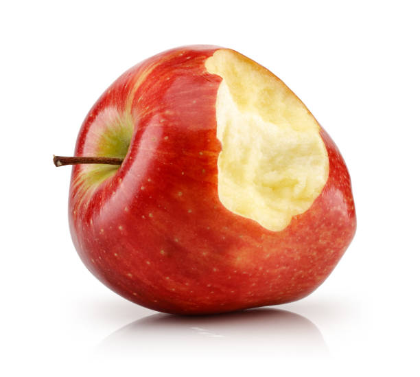 maçã vermelha mordida isolada no branco - apple missing bite fruit red - fotografias e filmes do acervo