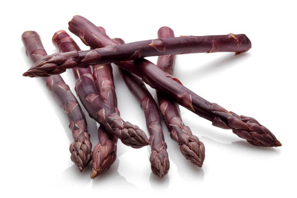 istock Purple asparagus sticks isolated on white 1146222457