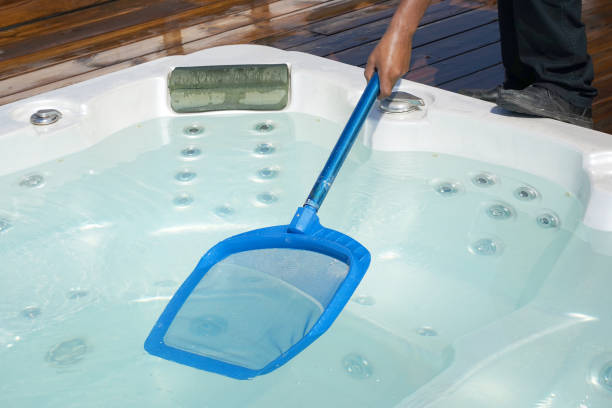 istock Hotel staff worker cleaning the pool. Maintenance. 1146222961