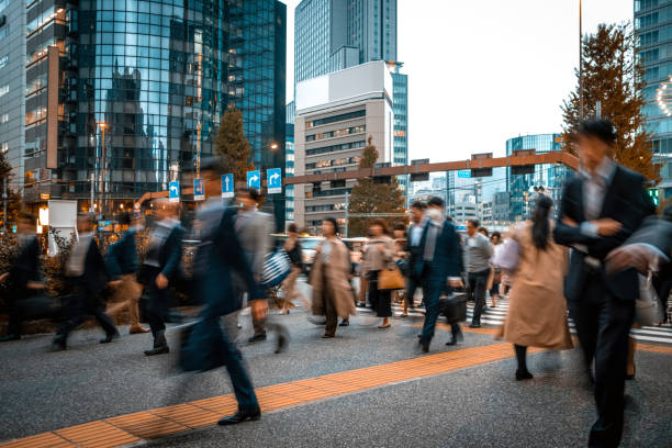istock Blurred business people on their way from work 1146224400