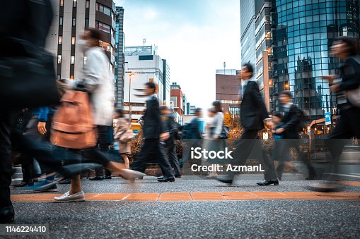 istock Blurred business people on their way from work 1146224410