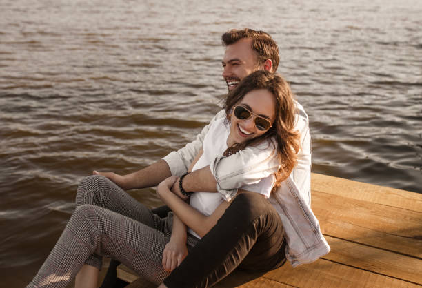 istock Excited couple hugging on pier 1146224477
