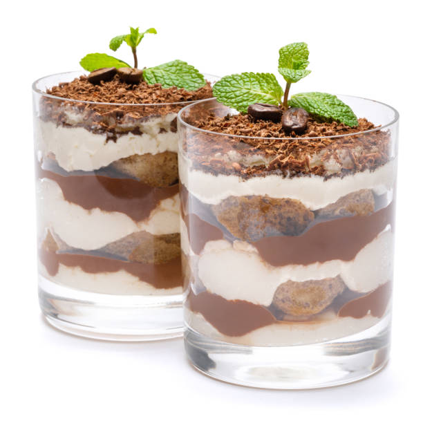 two portions Classic tiramisu dessert in a glass isolated on a white background with clipping path