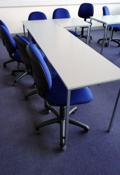 istock White school tables with blue chairs in a classroom 1146229655