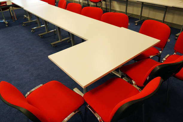 istock White school tables with red chairs in a classroom 1146229736