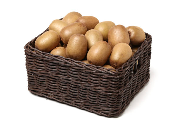istock Whole and cut golden kiwifruit/ kiwi (Actinidia chinensis) on white 1146230939