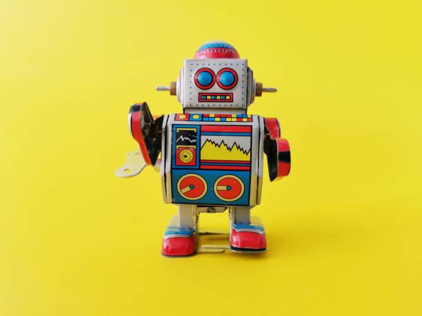 istock Close​ up​ robot on yellow background 1146231191
