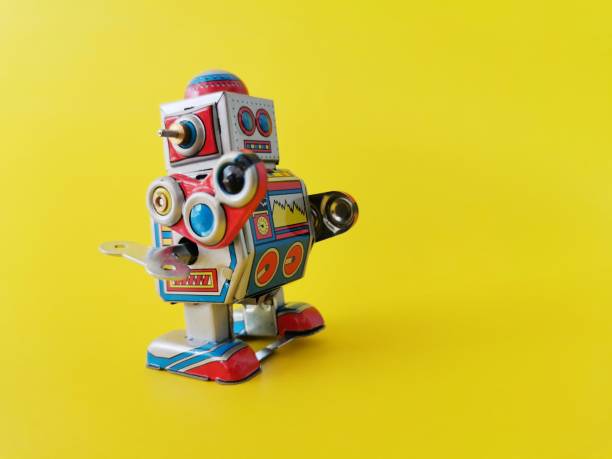 istock Close​ up​ robot on yellow background 1146231330