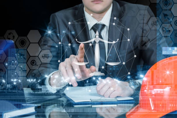 istock An engineer operating with juridical scales and financial system. 1146233264