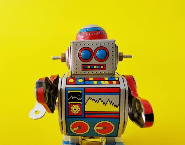 istock Close​ up​ robot on a yellow background 1146233326
