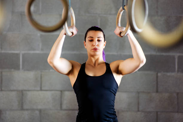 istock Young female athlete concentrating before workout 1146233674