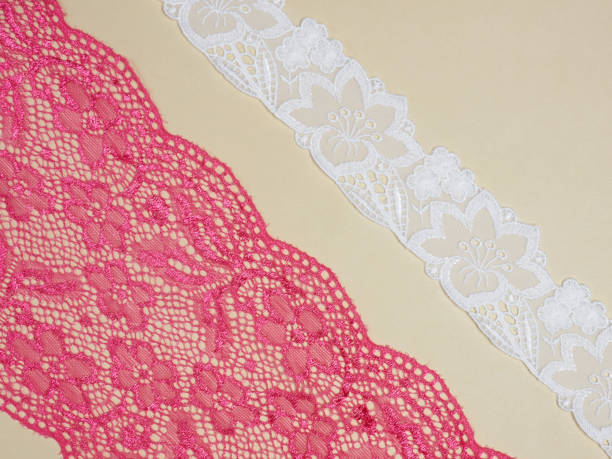 istock Red and white laces on a beige background diagonally in two row 1146239179
