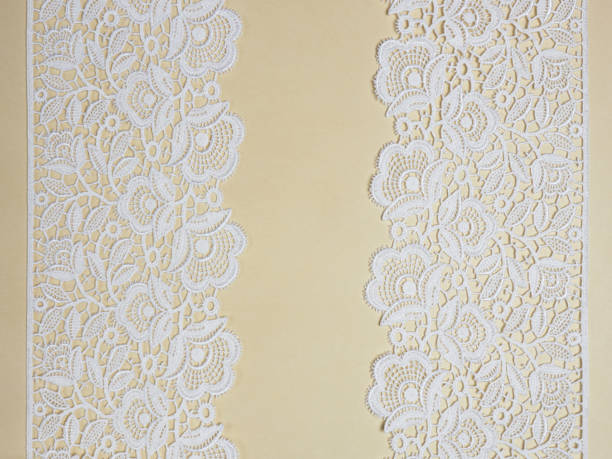 istock White laces on a beige background vertically in two row 1146240292