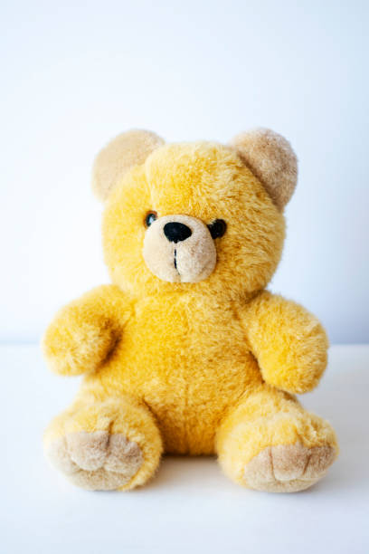 istock brown toy soft bear on white background childhood concept 1146240356